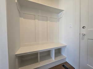 Mudroom featuring dark wood-style flooring