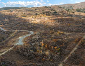 View of mountain background featuring rural landscape