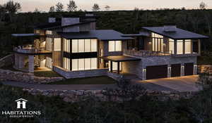 View of front facade featuring a garage, stone siding, a chimney, and a metal roof