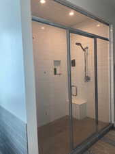 Full bath featuring a shower stall and recessed lighting