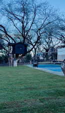 View of yard with community basketball court