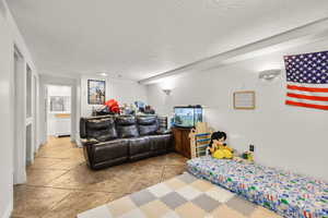 Bedroom featuring a textured ceiling