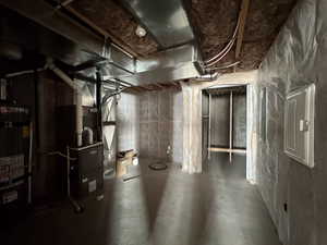 Unfinished basement with secured water heater and heating unit