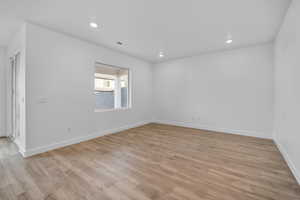 Spare room with recessed lighting and light wood-style flooring