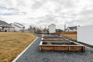 View of community with a trampoline, a garden, and a residential view