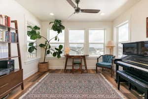 Living area featuring ceiling fan, dark wood finished floors, plenty of natural light, and recessed lighting