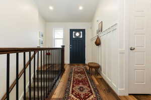 Entryway with hardwood / wood-style flooring