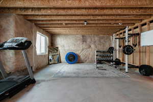 Exercise room featuring concrete flooring