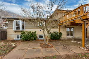 Rear view of property featuring a patio area and brick siding