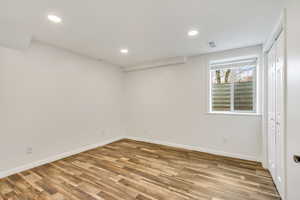 Empty room featuring recessed lighting and light wood-type flooring