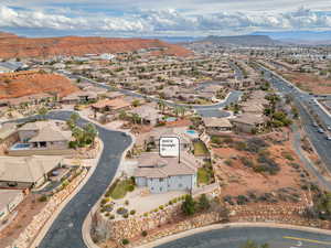 Aerial perspective of suburban area featuring a mountain backdrop