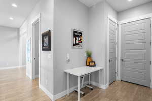 Hallway featuring recessed lighting and light wood finished floors