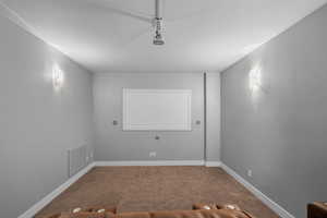 Home theater room with baseboards