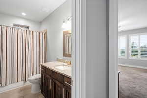 Full bathroom with vanity and shower / bathtub combination with curtain
