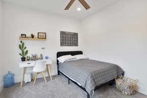 Bedroom with carpet floors, a ceiling fan, recessed lighting