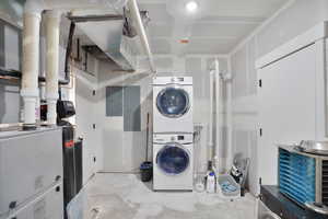 Laundry area located in huge storage room off main living room