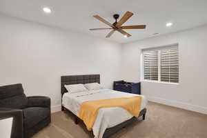 downstairs Bedroom featuring recessed lighting, carpet flooring, and ceiling fan