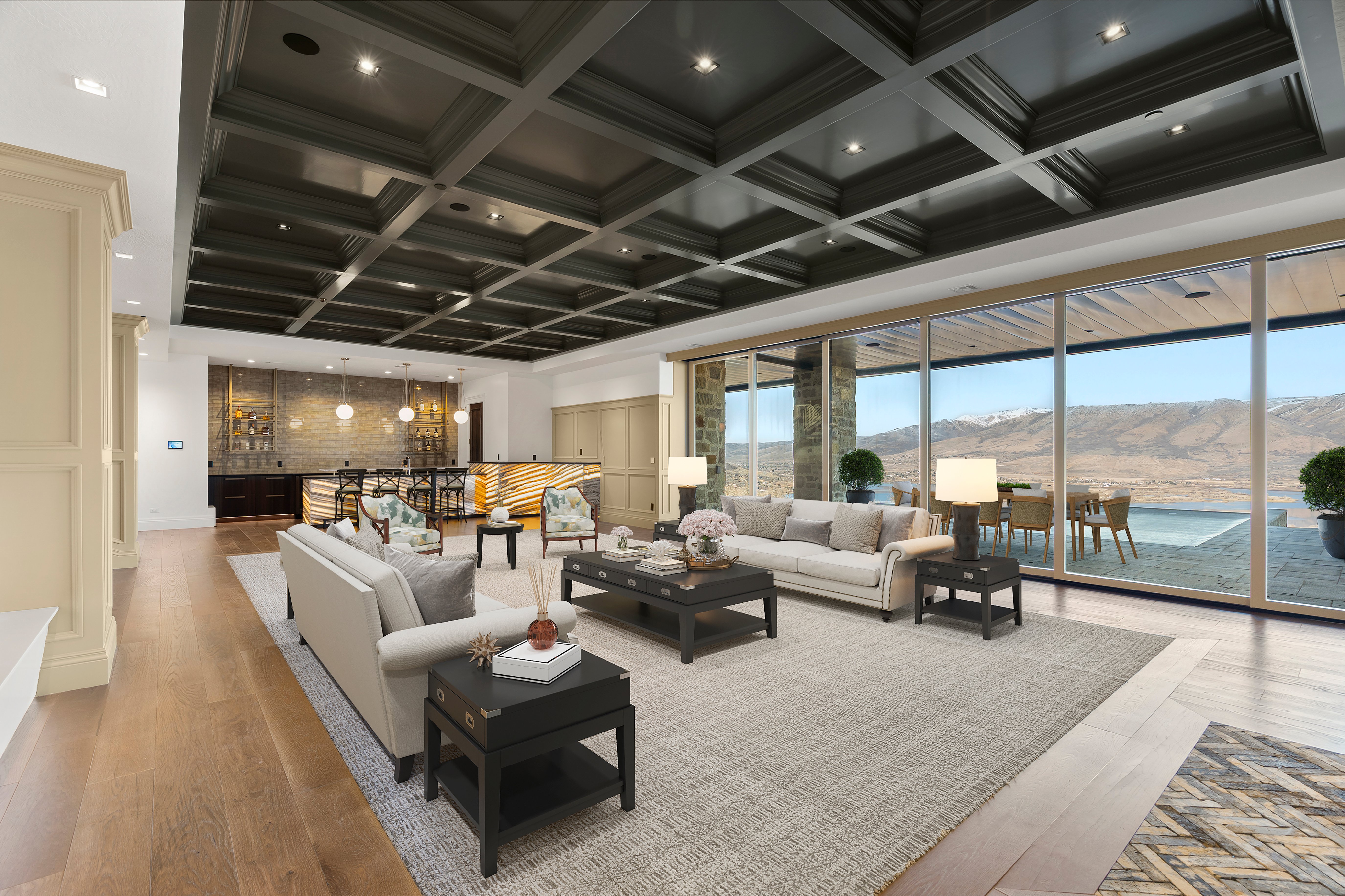 Community lobby featuring a mountain view, coffered ceiling, and recessed lighting