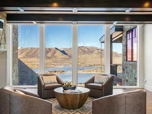 Sitting room with wood finished floors and a mountain view