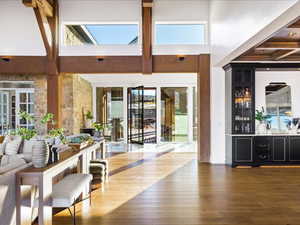 Interior space featuring dark wood-style floors and bar