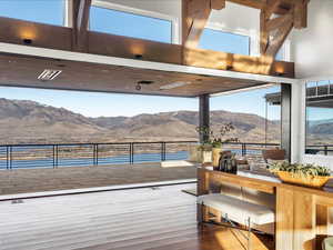 Deck with a mountain view and a patio