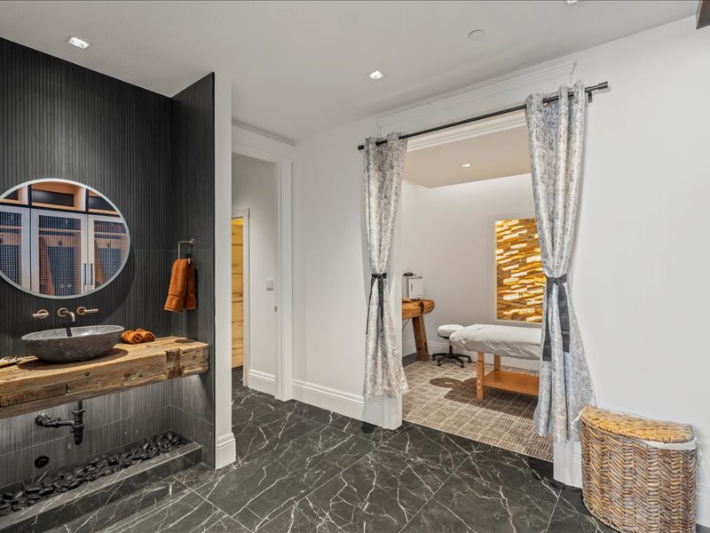 Full bathroom featuring dark marble finish flooring and recessed lighting