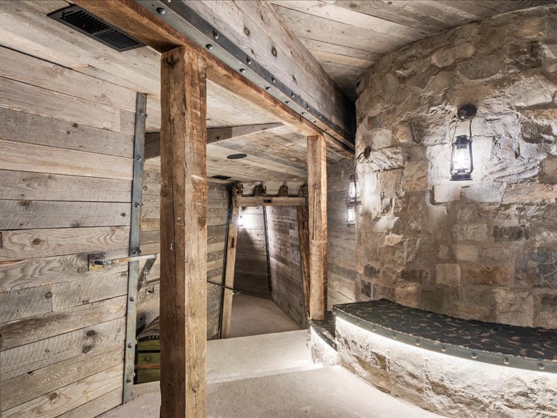 Hall with wood walls and concrete flooring