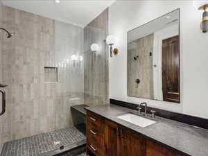 Full bath with vanity and a stall shower