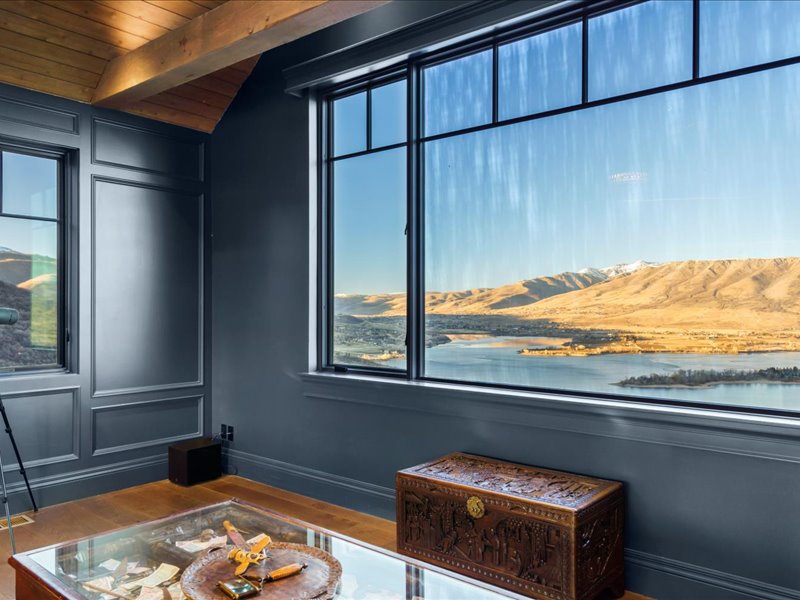 Detailed view of wood finished floors and a wood ceiling with exposed beams