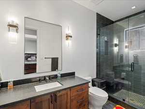 Bathroom featuring vanity and a stall shower