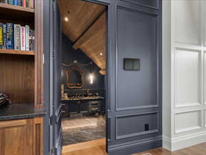 Detailed view of wood finished floors, recessed lighting, and wood ceiling