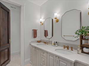 Full bath with double vanity and toilet