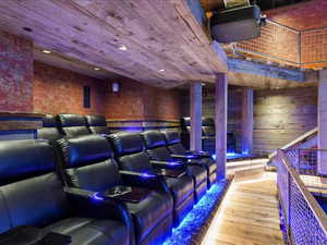 Home theater room with wood-type flooring, wooden ceiling, and recessed lighting