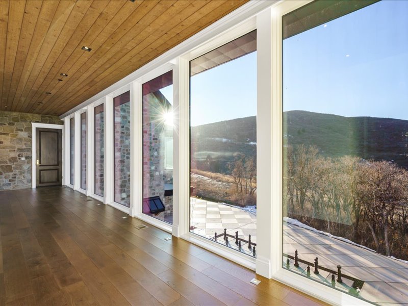 Unfurnished sunroom with a mountain view