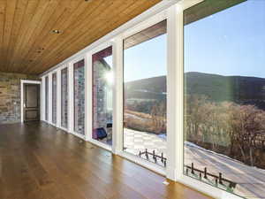 Unfurnished sunroom with a mountain view