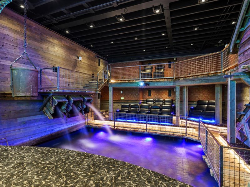 Game room featuring wood walls