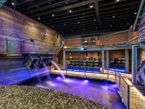 Game room featuring wood walls