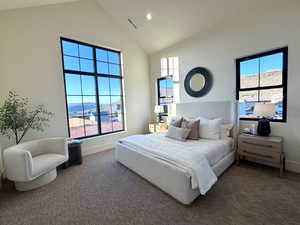 Bedroom featuring recessed lighting, a mountain view, carpet floors, and a high ceiling