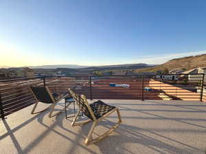 View of patio / terrace featuring a mountain view and a residential view