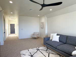 Sitting room with carpet flooring, ceiling fan, and recessed lighting