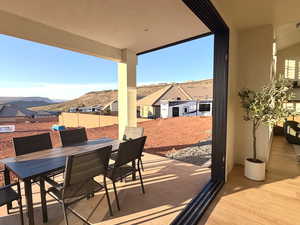 View of patio featuring outdoor dining area and a mountain view
