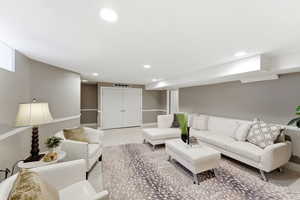 Living area featuring recessed lighting and carpet floors
