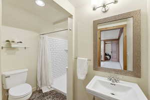 Bathroom featuring a shower stall and recessed lighting