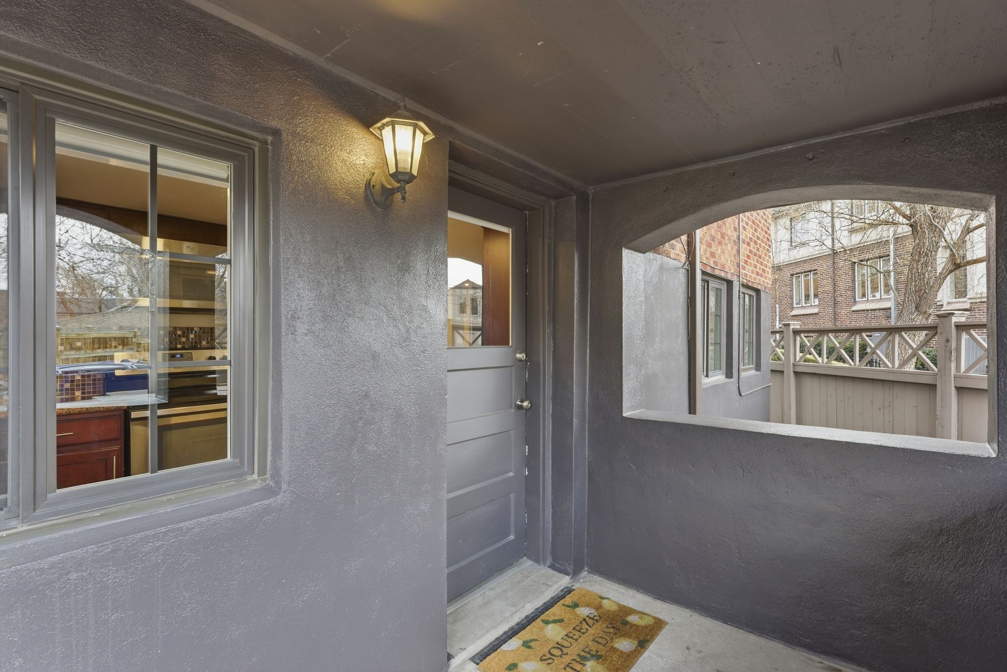 Property entrance with stucco siding