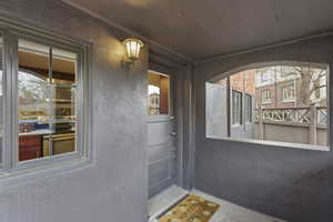 Property entrance with stucco siding