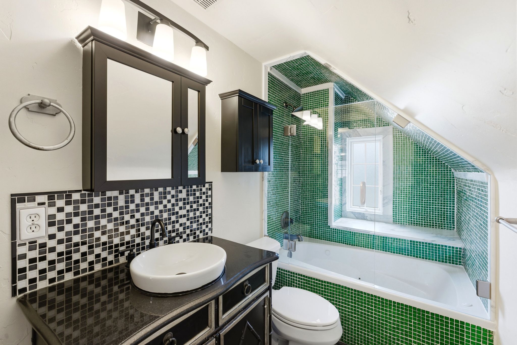 Full bathroom featuring tiled shower / bath combo and vanity