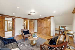 Living area featuring wood finished floors and recessed lighting