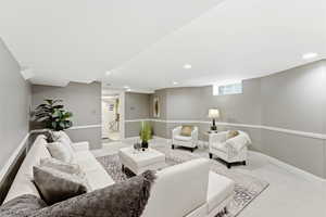 Living room with carpet and recessed lighting