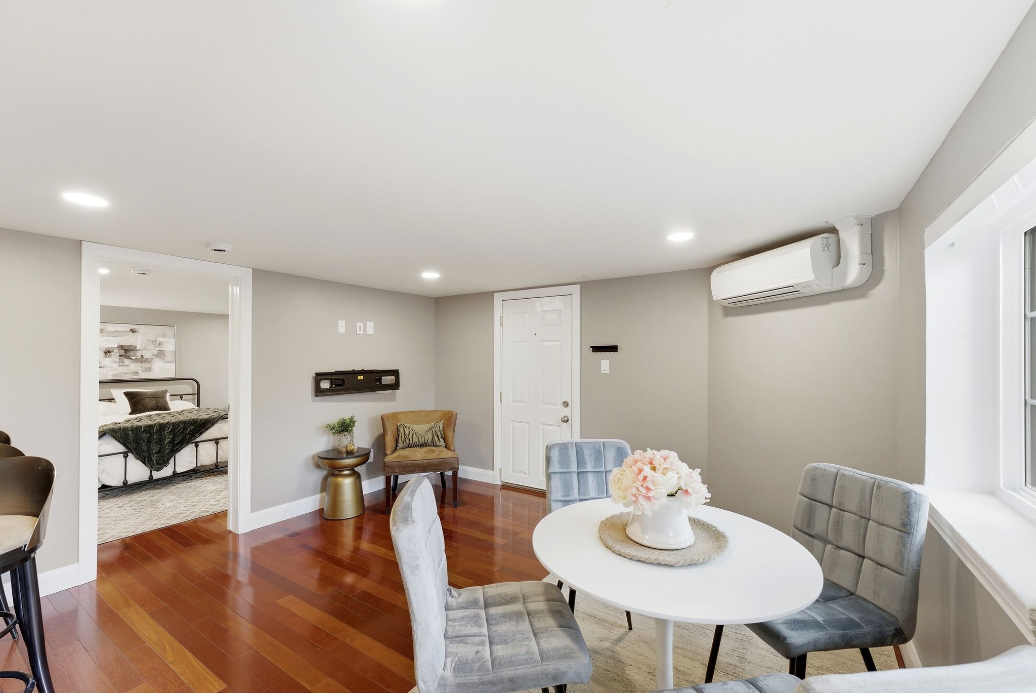 Dining space with dark wood-type flooring and recessed lighting