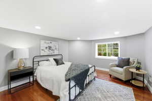 Bedroom with wood finished floors and recessed lighting